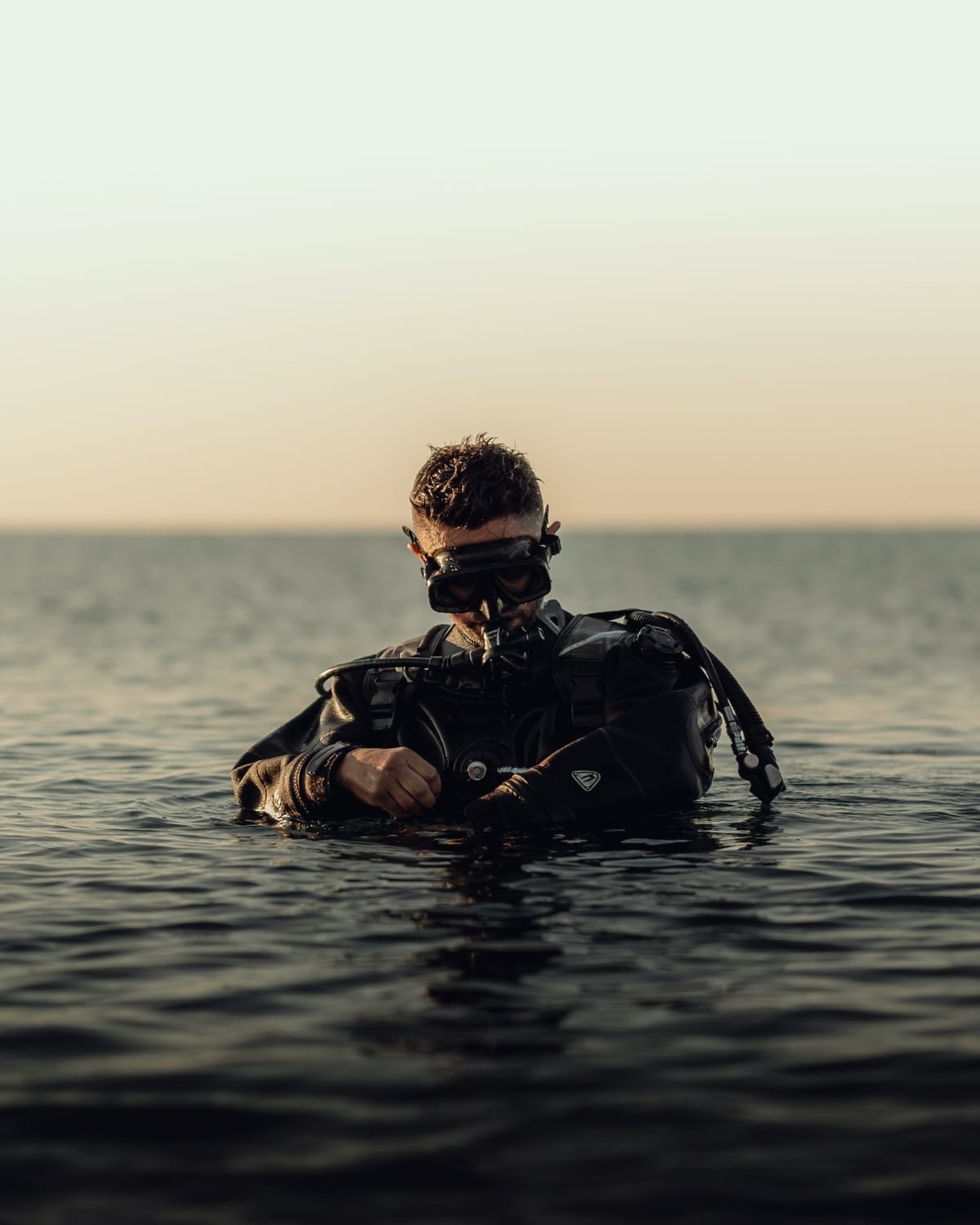 Man in water with scuba dive gear on
